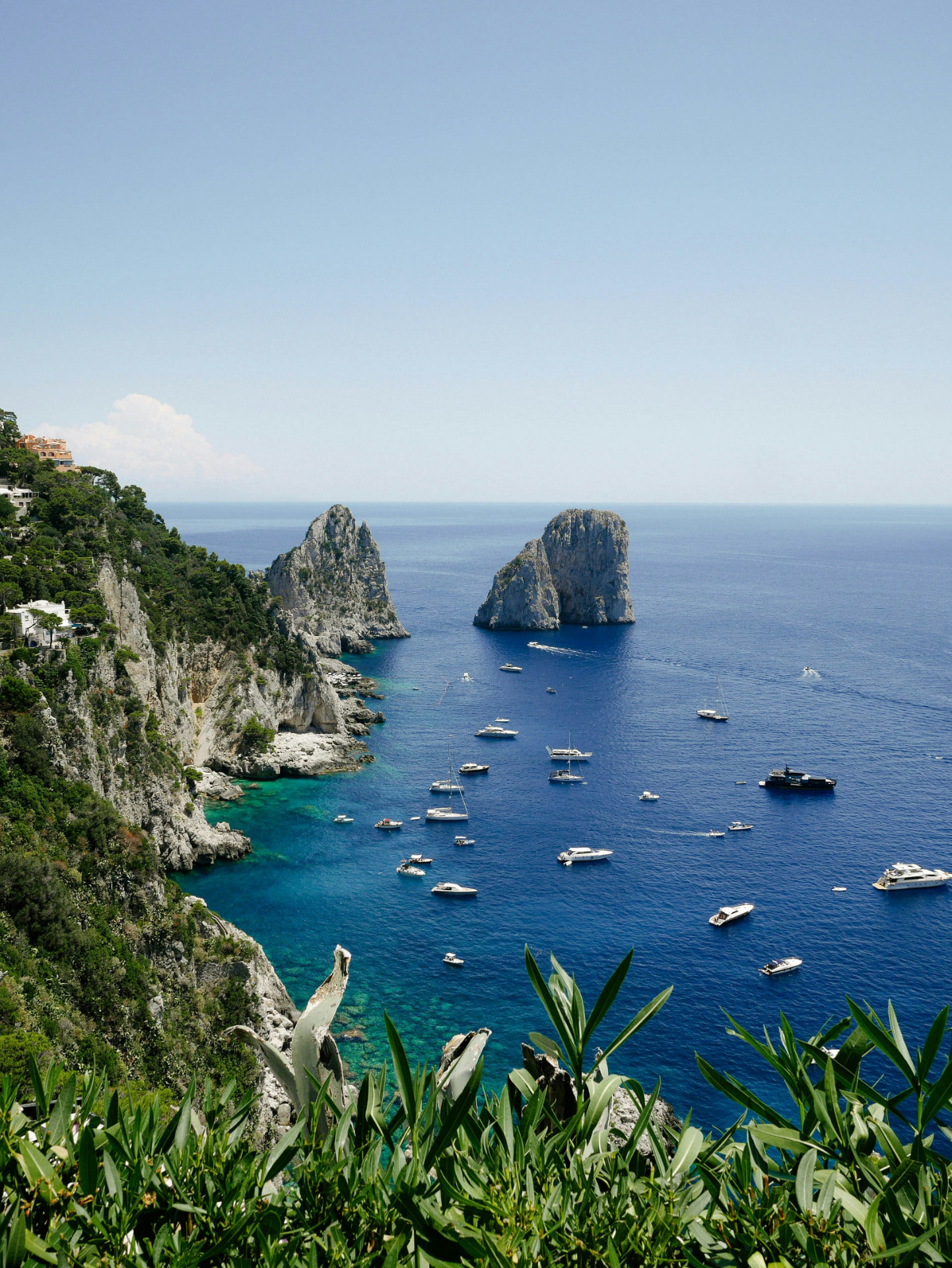 The Faraglioni rocks rising out of the blue sea in Capri