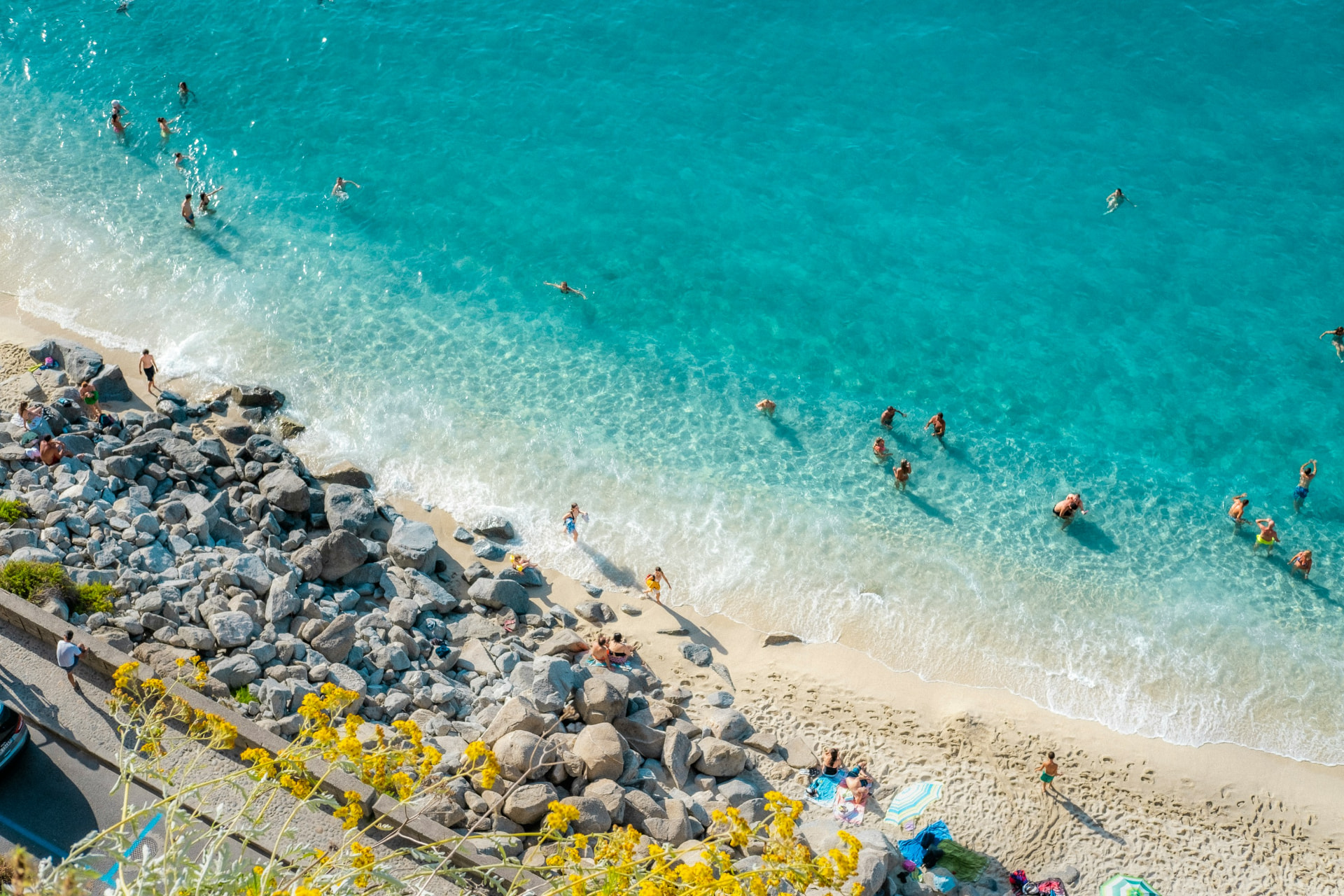 Turquoise water and sandy cove below Tropea